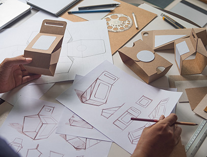 Designer sketching drawing of sustainable packaging