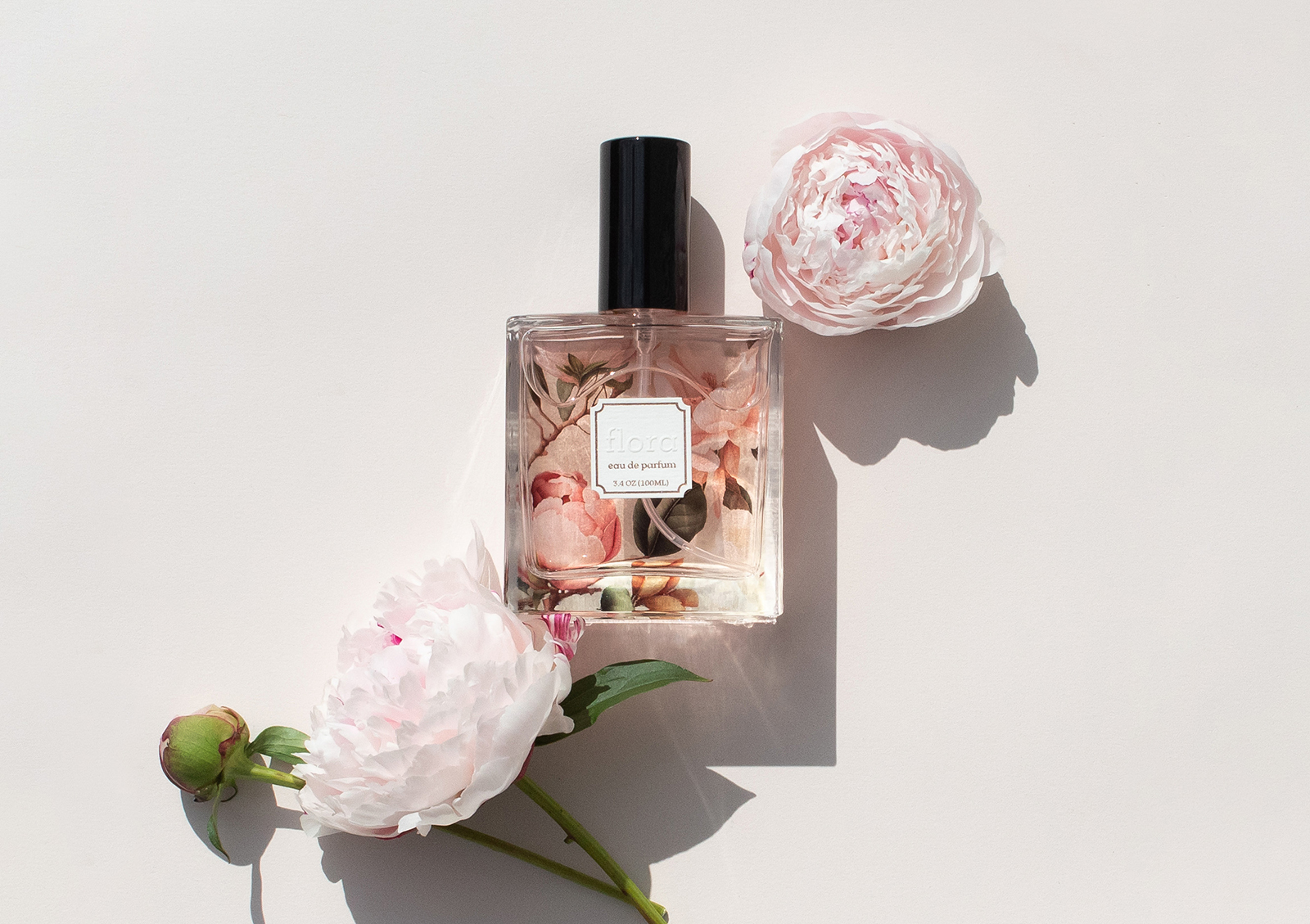 image of perfume with blind emboss double-sided label and rose gold hot stamp foil