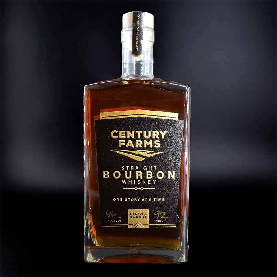 Century Farms bourbon bottle featuring a custom label by Brook + Whittle. The label is elegantly embossed and enhanced with gold foil hot stamping, showcasing the high-quality craftsmanship of Brook + Whittle's custom label designs.